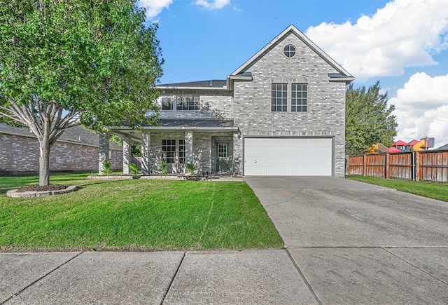 front of property with a front yard and a garage