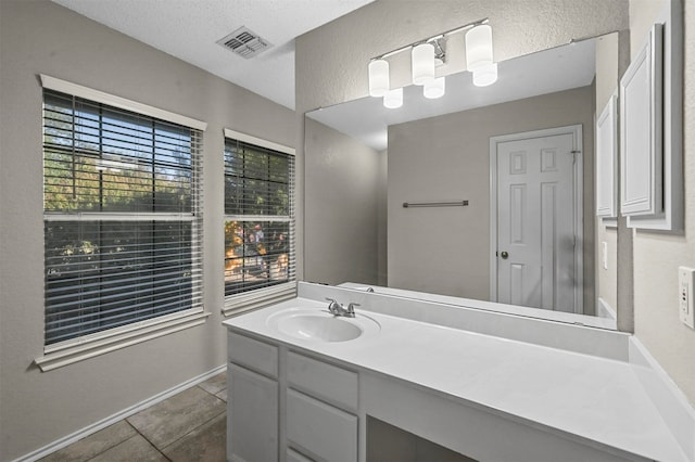 bathroom featuring vanity and tile patterned flooring