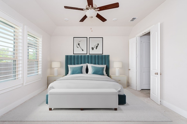 carpeted bedroom with lofted ceiling and ceiling fan