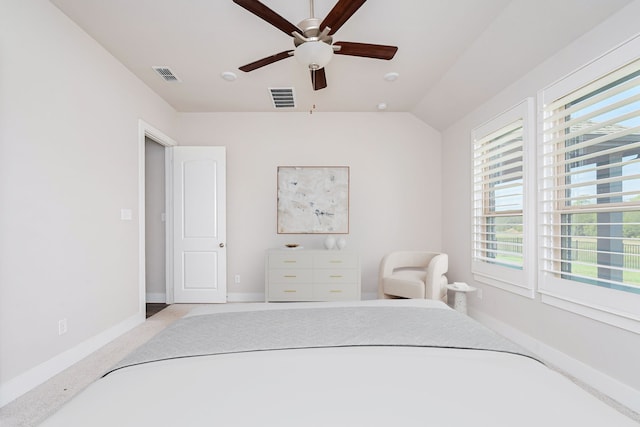 carpeted bedroom with lofted ceiling and ceiling fan