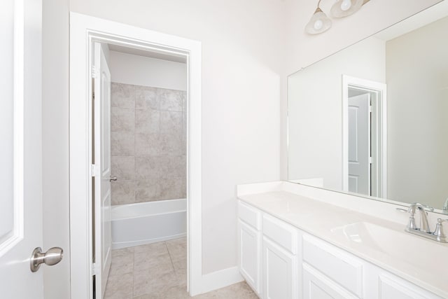 bathroom featuring vanity, tiled shower / bath combo, and tile patterned flooring