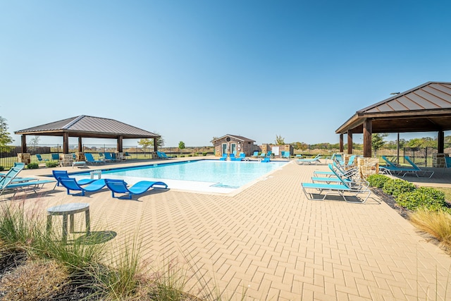 view of swimming pool featuring a gazebo and a patio area