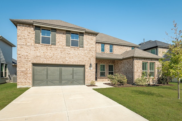 view of front of house featuring a garage and a front yard