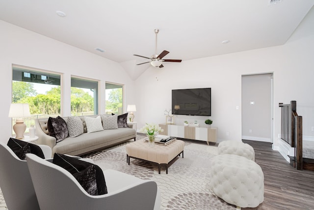 living room featuring vaulted ceiling, hardwood / wood-style floors, and ceiling fan