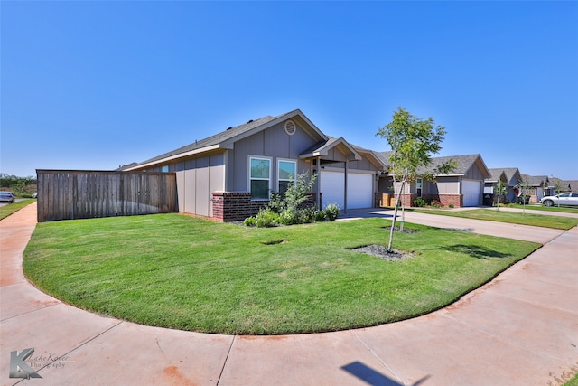 view of front facade featuring a front lawn and a garage