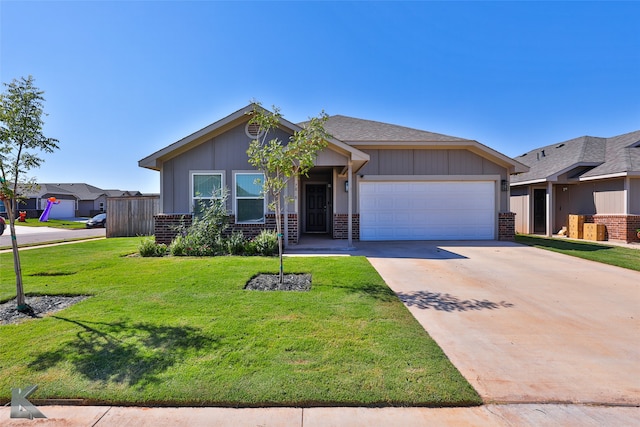 view of front facade with a front yard and a garage