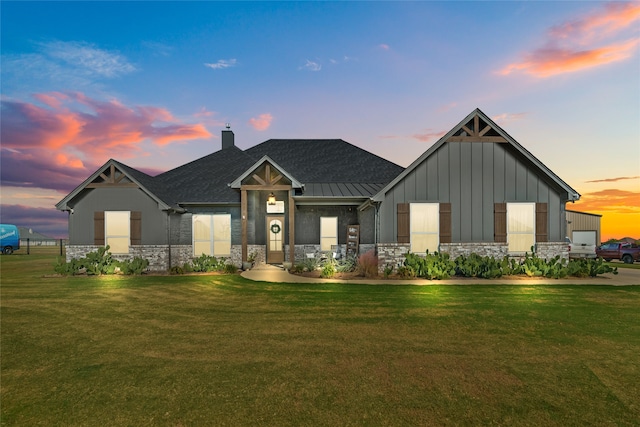 view of front of home with a lawn