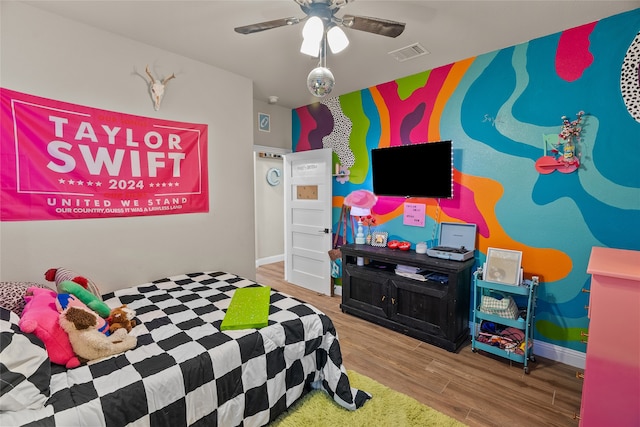 bedroom featuring hardwood / wood-style floors and ceiling fan