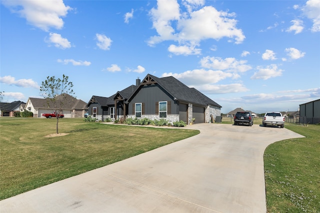 view of front of property with a garage and a front lawn