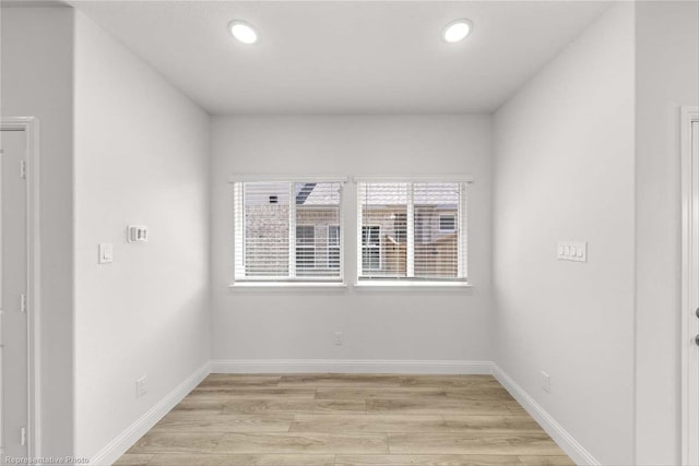 spare room with light hardwood / wood-style floors