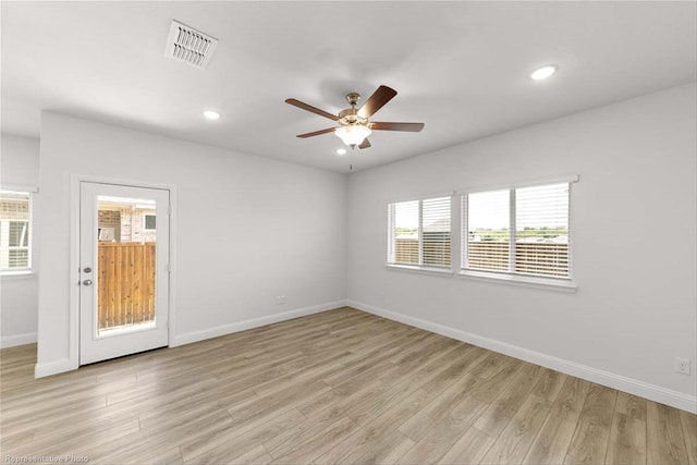 unfurnished room featuring light wood-type flooring and ceiling fan