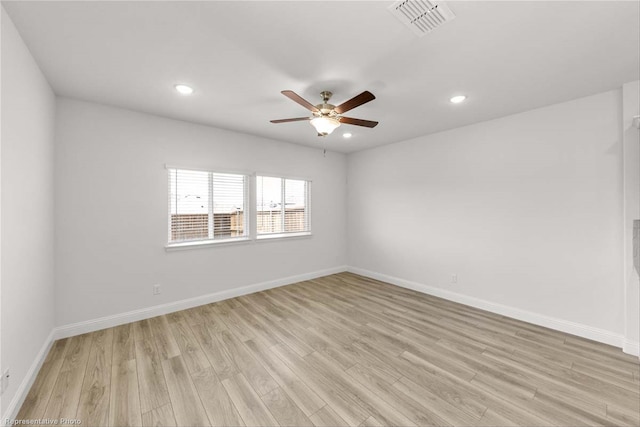 spare room with ceiling fan and light hardwood / wood-style flooring