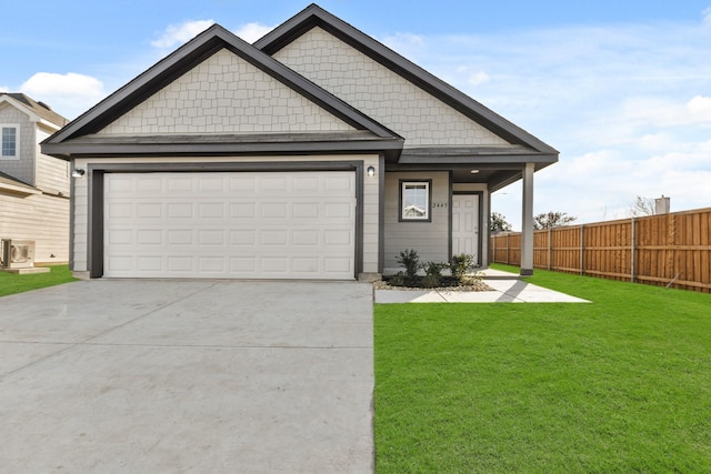 view of front of house with a front lawn, cooling unit, and a garage