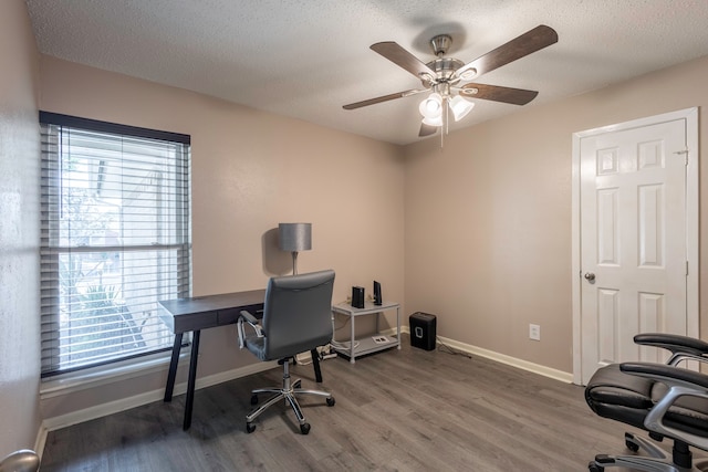 office with a textured ceiling, wood-type flooring, and ceiling fan