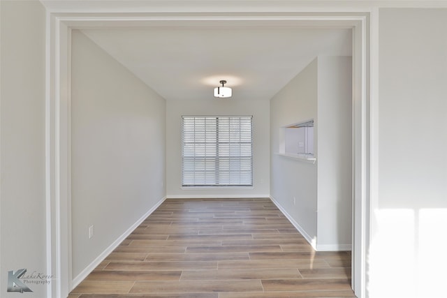 unfurnished dining area with light hardwood / wood-style flooring