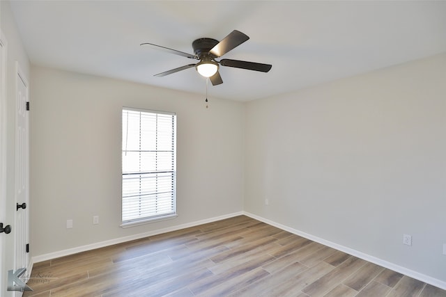 spare room with light hardwood / wood-style floors and ceiling fan