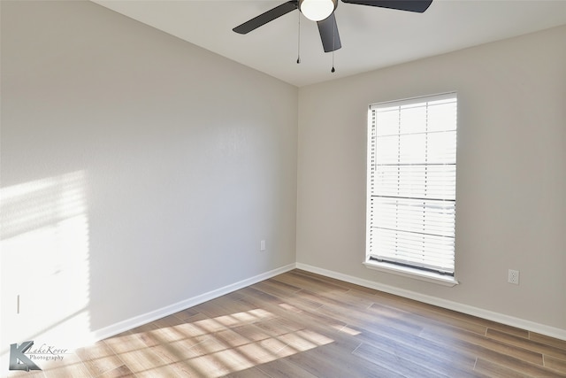 empty room featuring light hardwood / wood-style flooring and ceiling fan