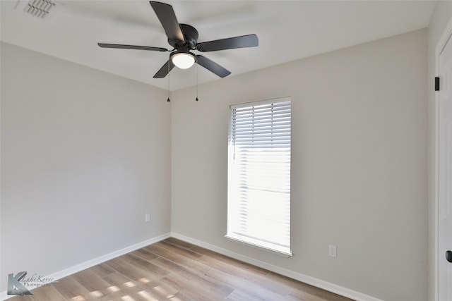 spare room with ceiling fan, light hardwood / wood-style floors, and plenty of natural light