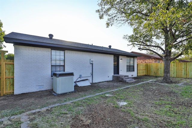 back of property with central AC unit