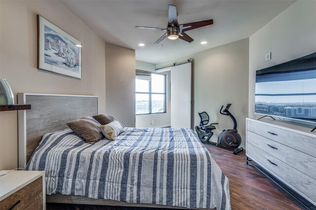 bedroom with dark hardwood / wood-style floors and ceiling fan