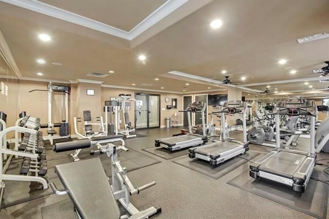 gym with ornamental molding and ceiling fan