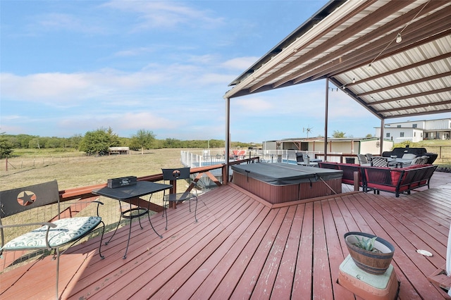 wooden deck featuring a covered hot tub