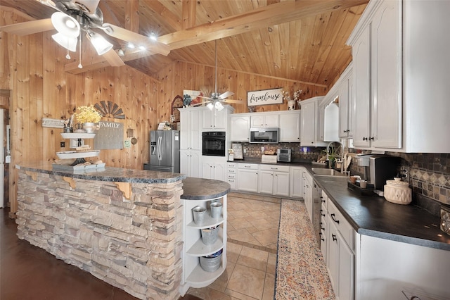 kitchen with stainless steel appliances, dark countertops, a ceiling fan, wood ceiling, and tasteful backsplash