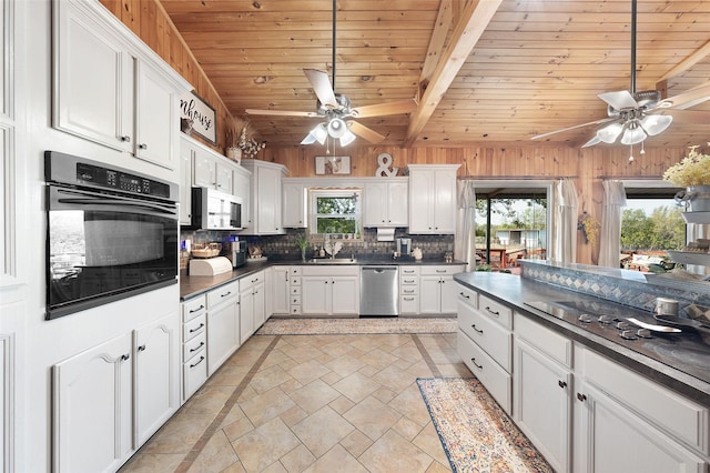 kitchen with backsplash, dark countertops, ceiling fan, and black appliances