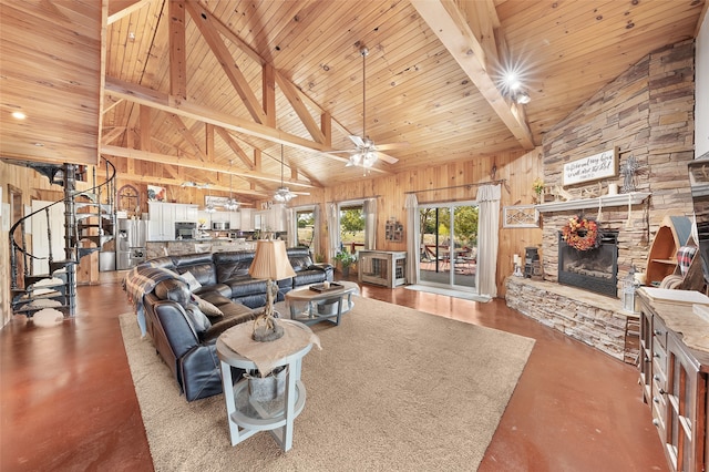 living room with beam ceiling, wooden walls, wooden ceiling, a fireplace, and high vaulted ceiling