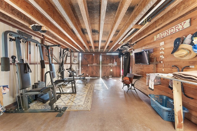 workout area with wooden walls