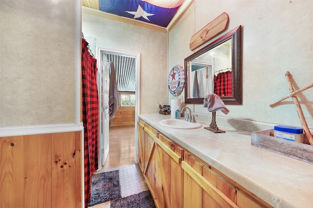 bathroom featuring vanity, ornamental molding, and tile patterned floors