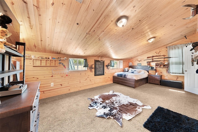 bedroom with vaulted ceiling, carpet, wood walls, and wood ceiling