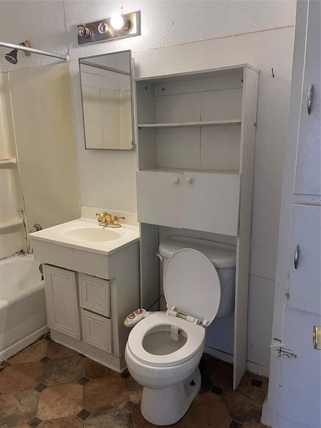 full bathroom with vanity, bathtub / shower combination, and toilet