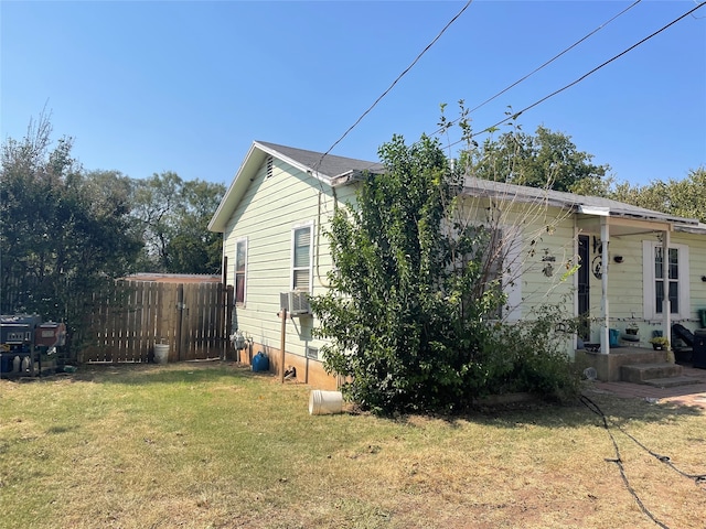 view of side of property featuring a yard