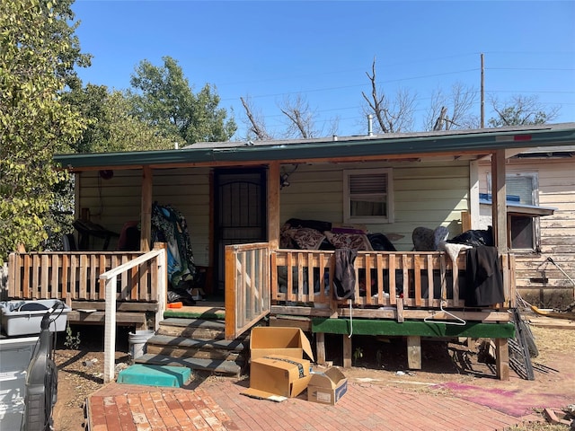 back of house featuring a deck