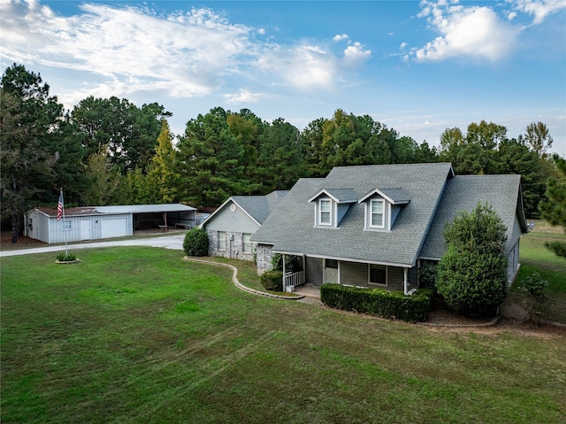 cape cod-style house featuring a porch, an outdoor structure, a front lawn, and a garage