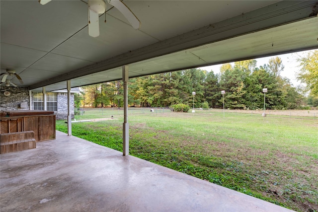 view of yard featuring a patio area and ceiling fan