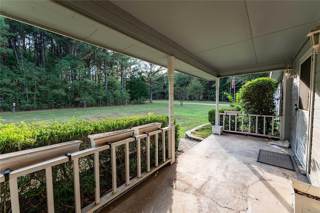 1490 Farm Rd Unit 2120, Clarksville, TX 75426 - view of patio featuring a view of trees and a porch