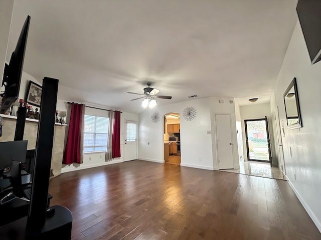 living room featuring dark hardwood / wood-style floors and ceiling fan