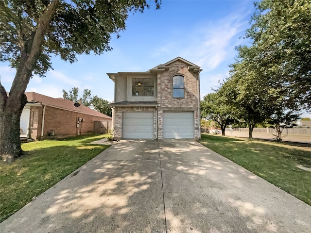 view of front facade with a front yard and a garage