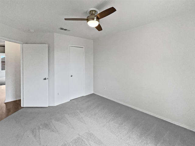 5103 Whitehaven Dr, Garland, TX 75043 - unfurnished bedroom featuring carpet floors, baseboards, a ceiling fan, and a closet