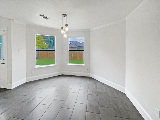 5103 Whitehaven Dr, Garland, TX 75043 - unfurnished dining area featuring ornamental molding and baseboards