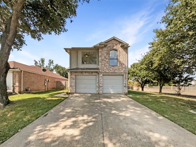 view of front of property featuring a garage and a front lawn