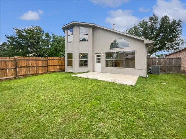 5103 Whitehaven Dr, Garland, TX 75043 - back of property featuring central AC, stucco siding, and a patio area
