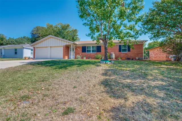 ranch-style home with a garage and a front lawn