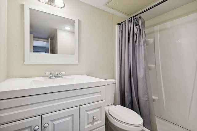 bathroom featuring toilet, a shower with curtain, and vanity