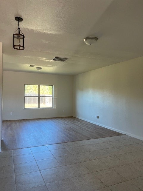 spare room with light hardwood / wood-style floors