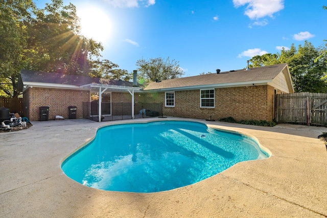 view of swimming pool with a pergola and a patio area