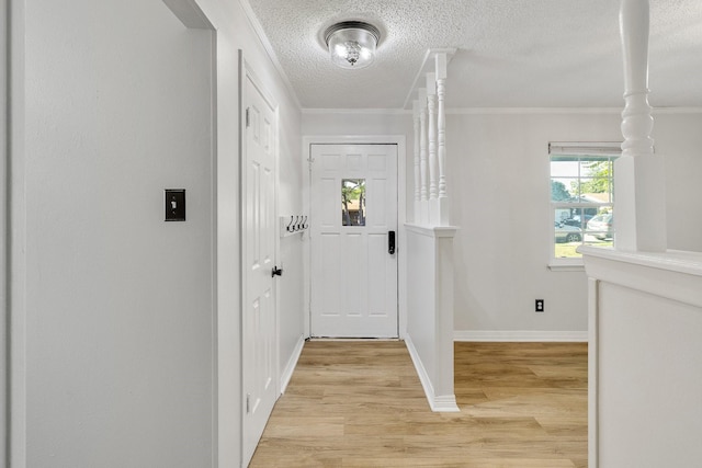 entryway featuring light hardwood / wood-style flooring and crown molding