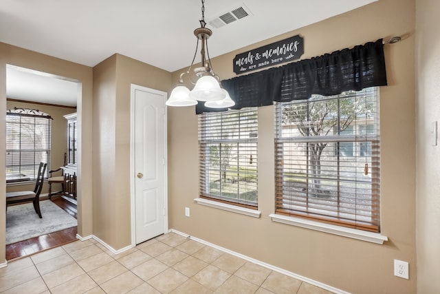 dining room featuring hardwood / wood-style floors and an inviting chandelier